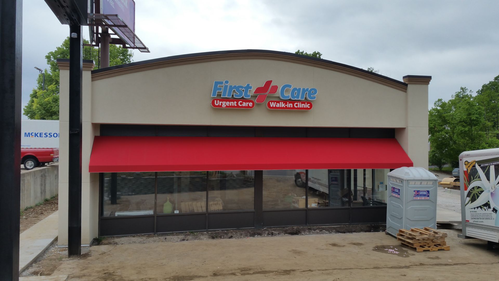 A building with a red awning on the front of it.
