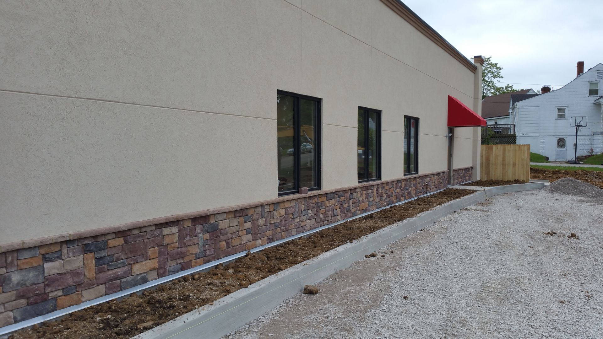 A building with a red awning on the side of it.