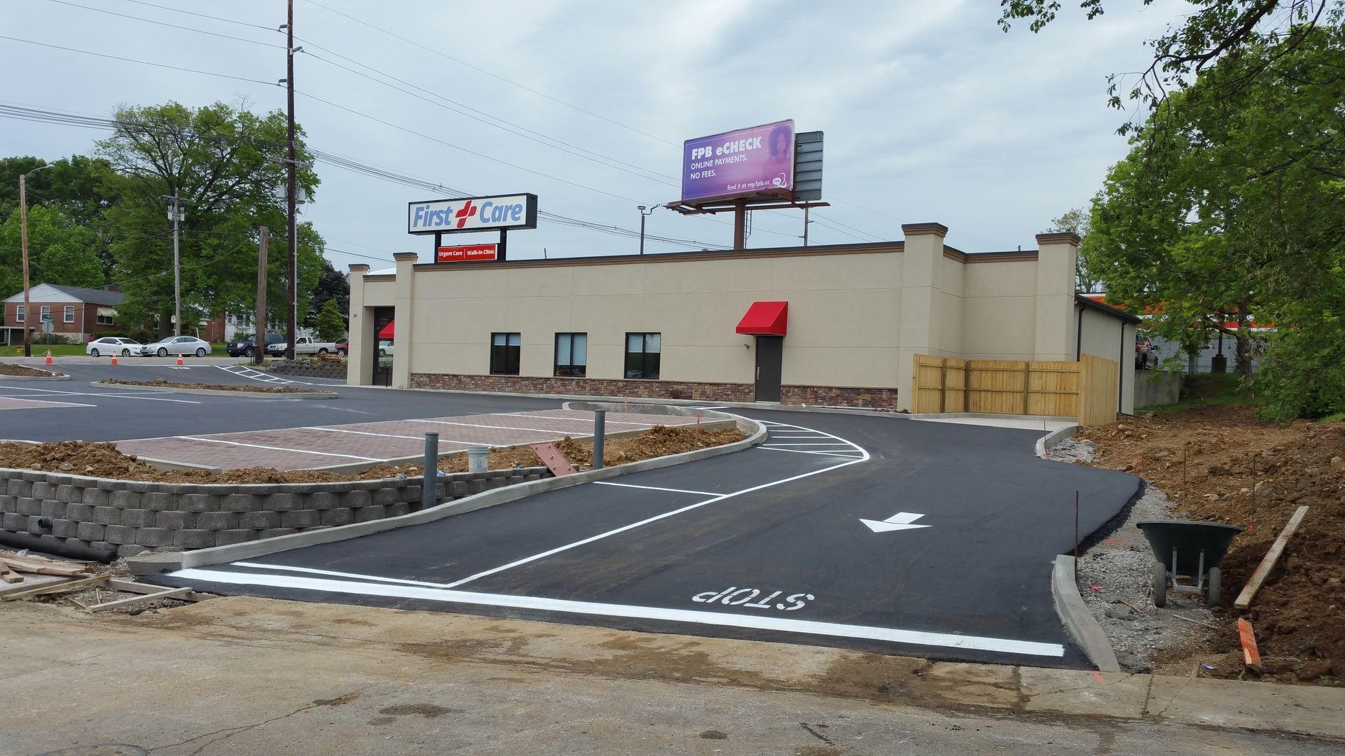 A building with a purple billboard on top of it