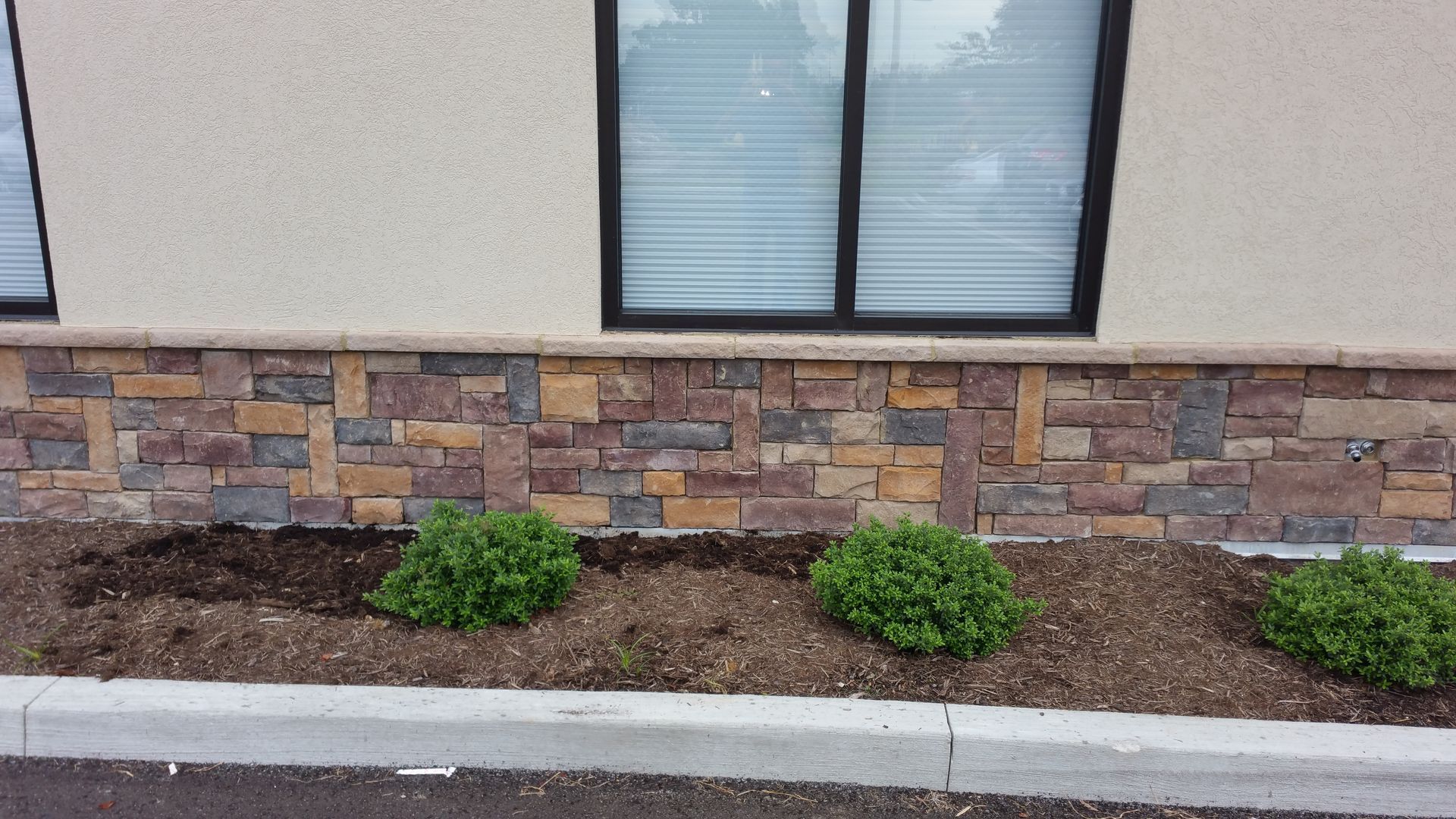 A building with a stone wall and a window
