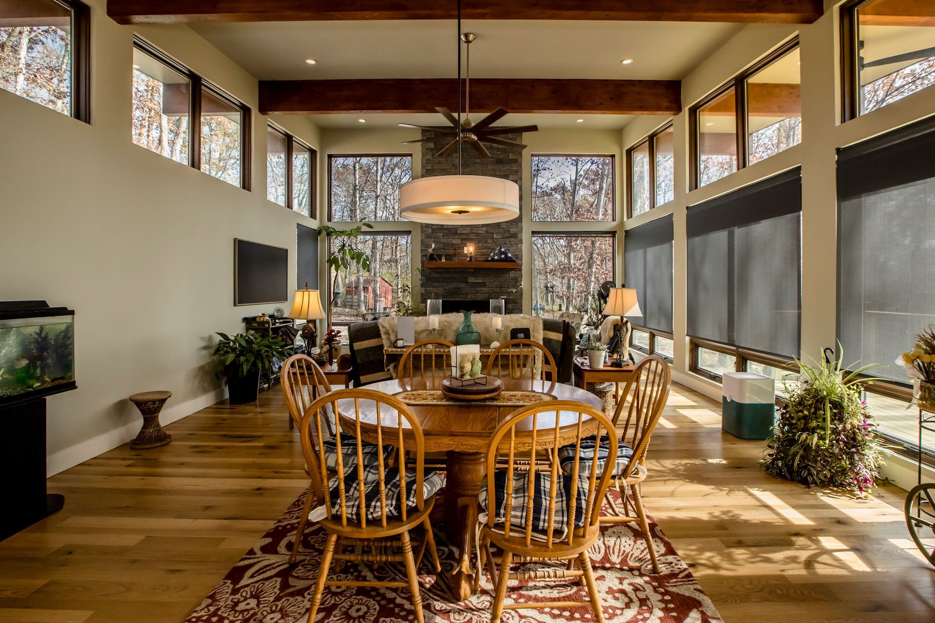 A large living room with a dining table and chairs.