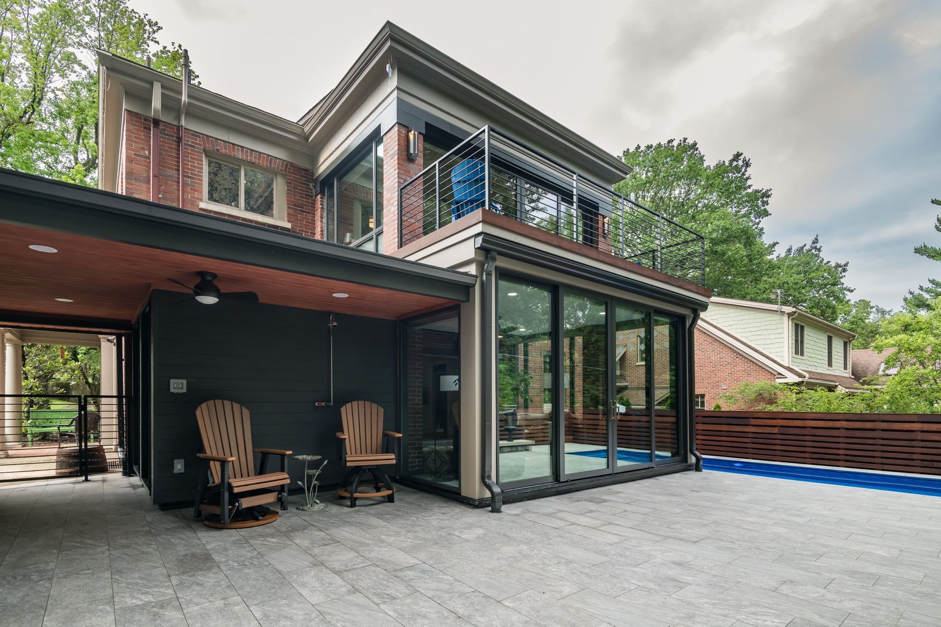 A large house with a swimming pool in the backyard
