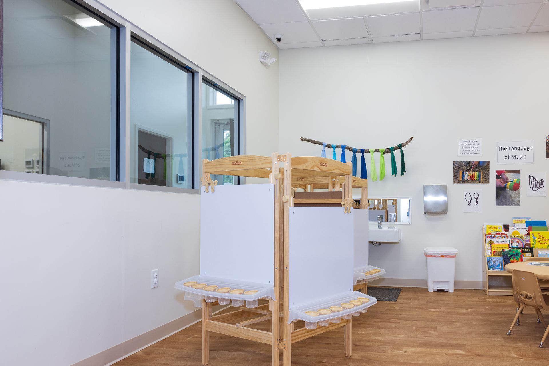 A room with a table and a sink in it.