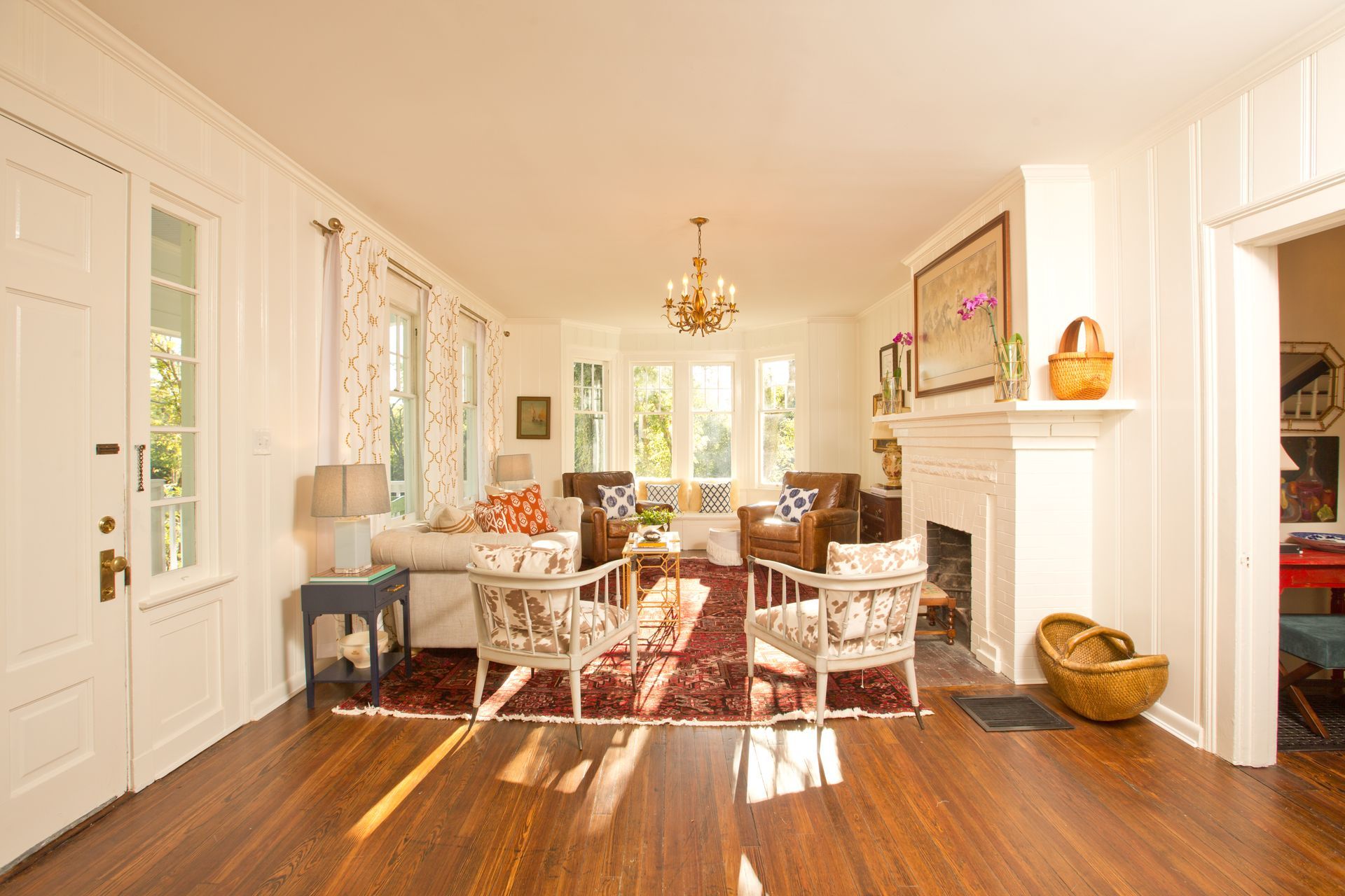 A living room with hardwood floors and a fireplace