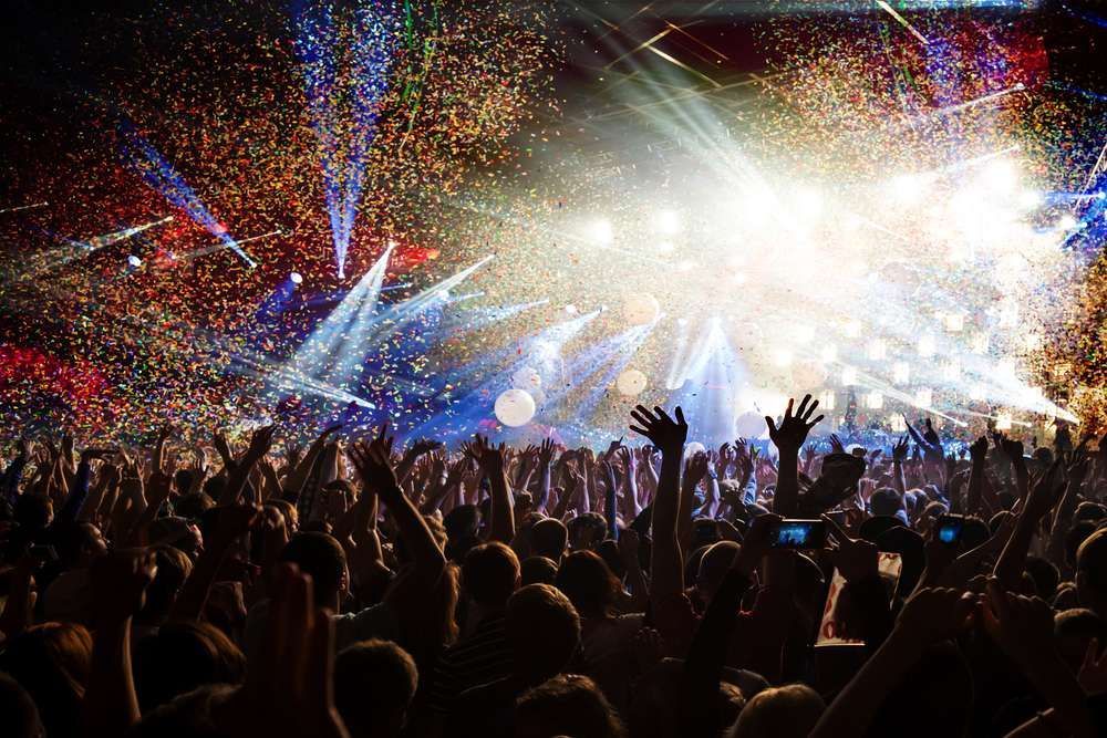 A Crowd Of People Are Standing In Front Of A Stage At A Concert — HYP-E-VENTS In Spence, ACT