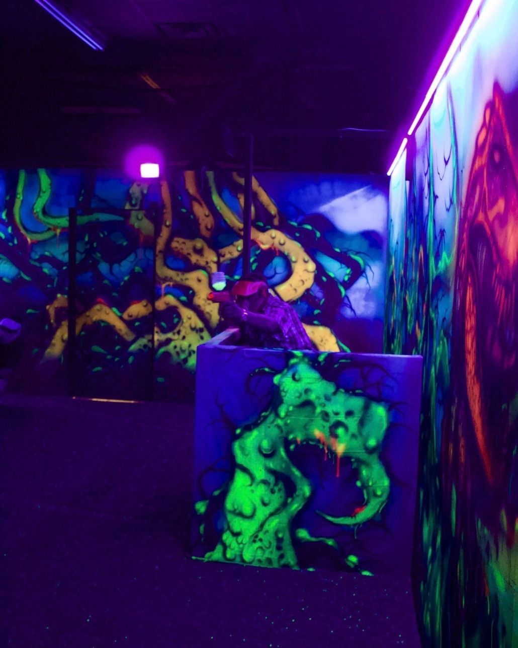 A room with glow in the dark paintings on the walls