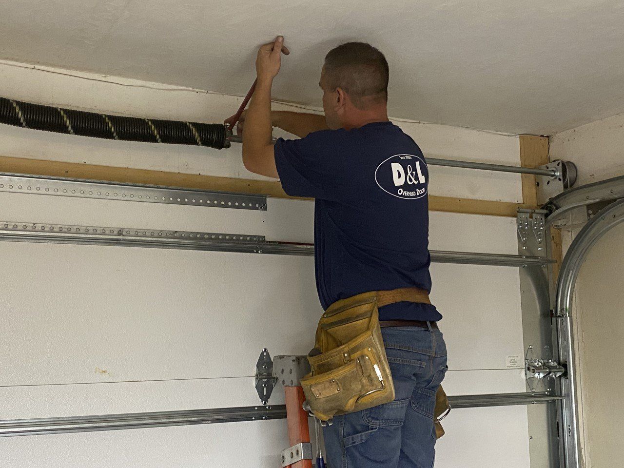 Garage Door Spring Replacement - D&L Overhead Door