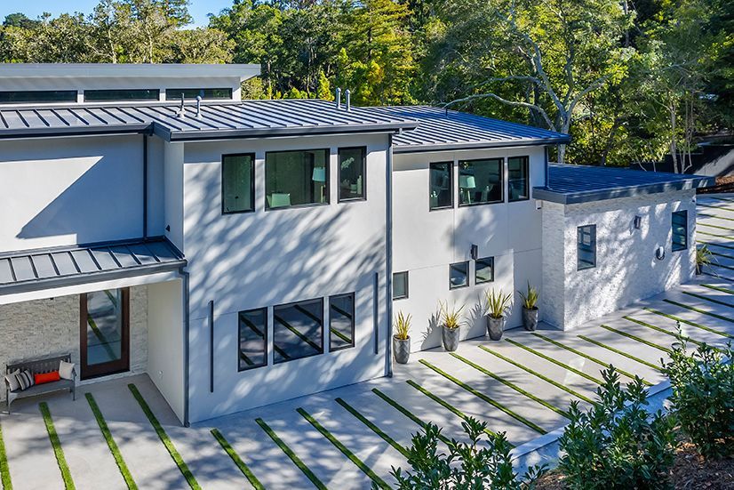 The new upper story addition greatly enhances the street view of the house