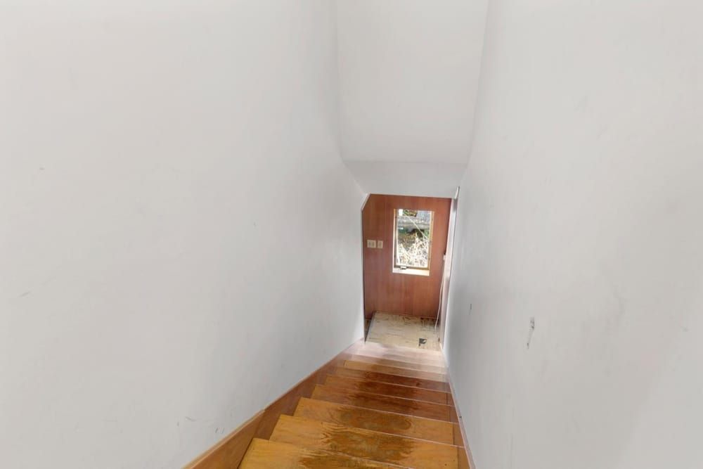 The existing stair was narrow and closed to the living spaces