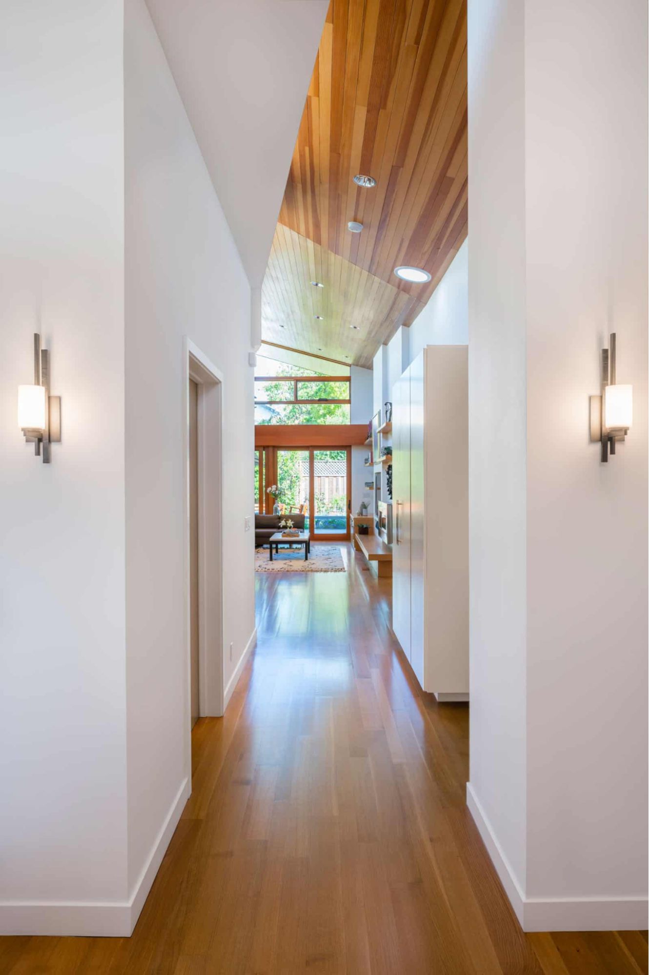 A glimpse into the unique great room from the entry foyer