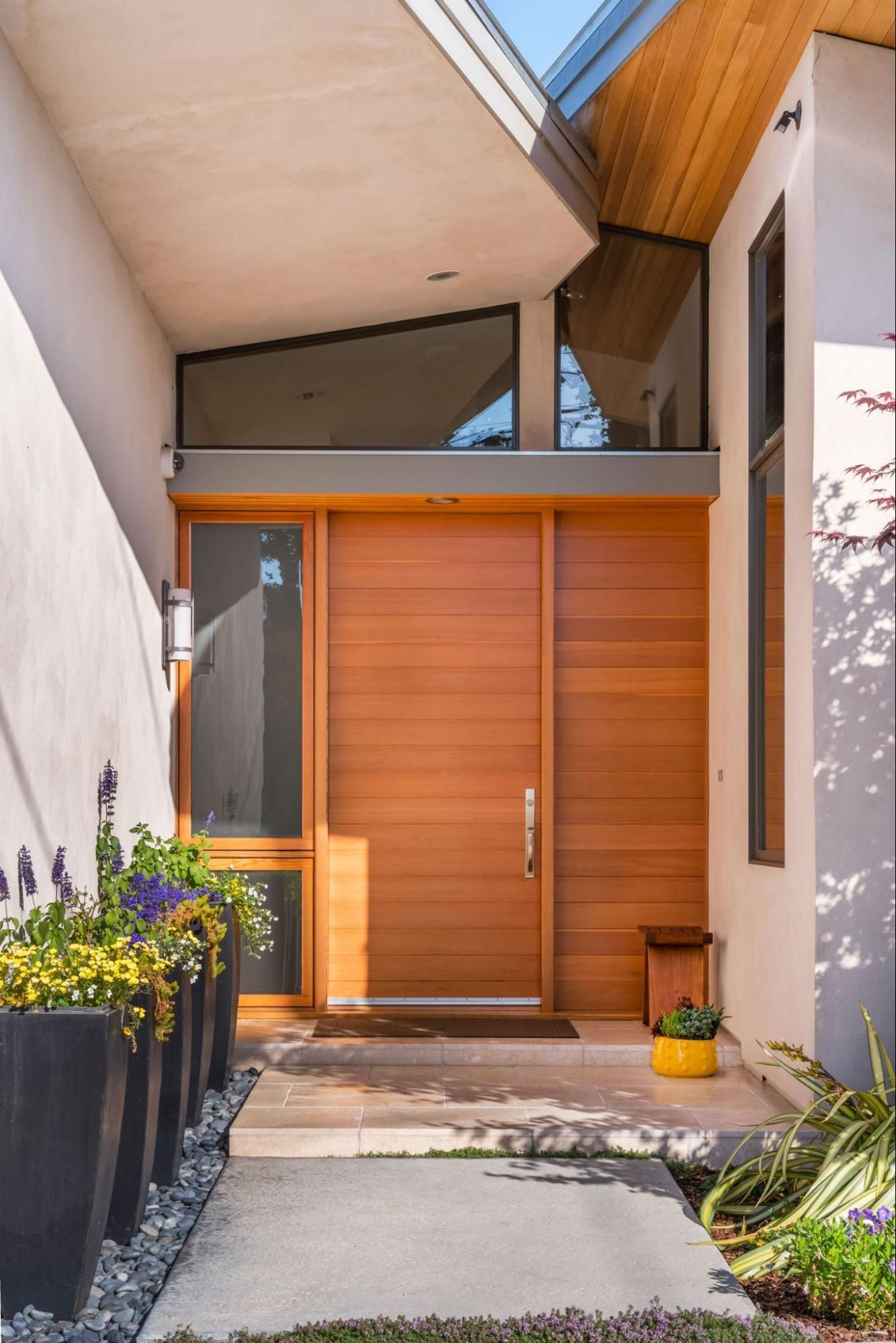 Custom douglas fir plank entry door with sidelight and transom 