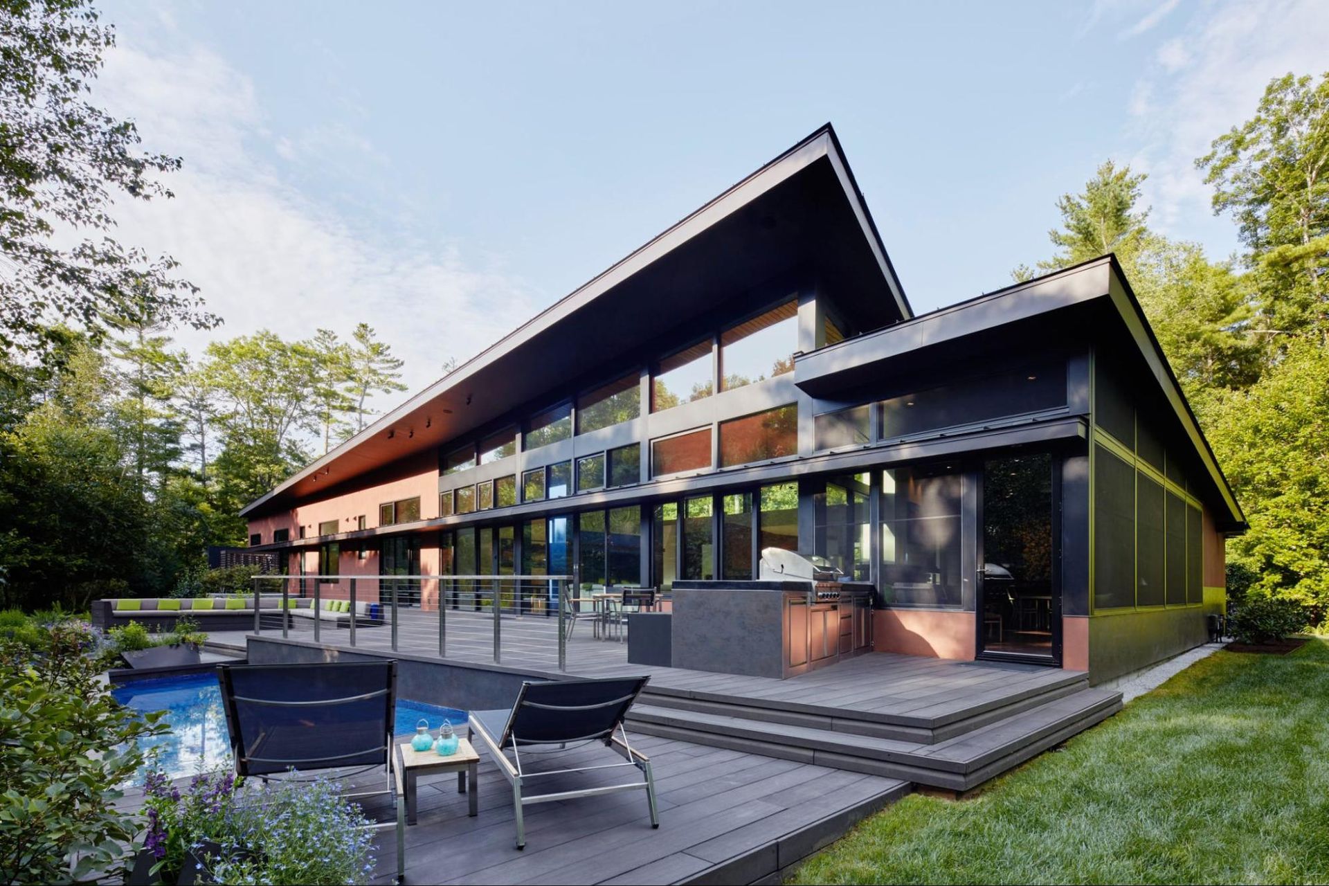 Sleek roof lines and expansive windows at the back deck