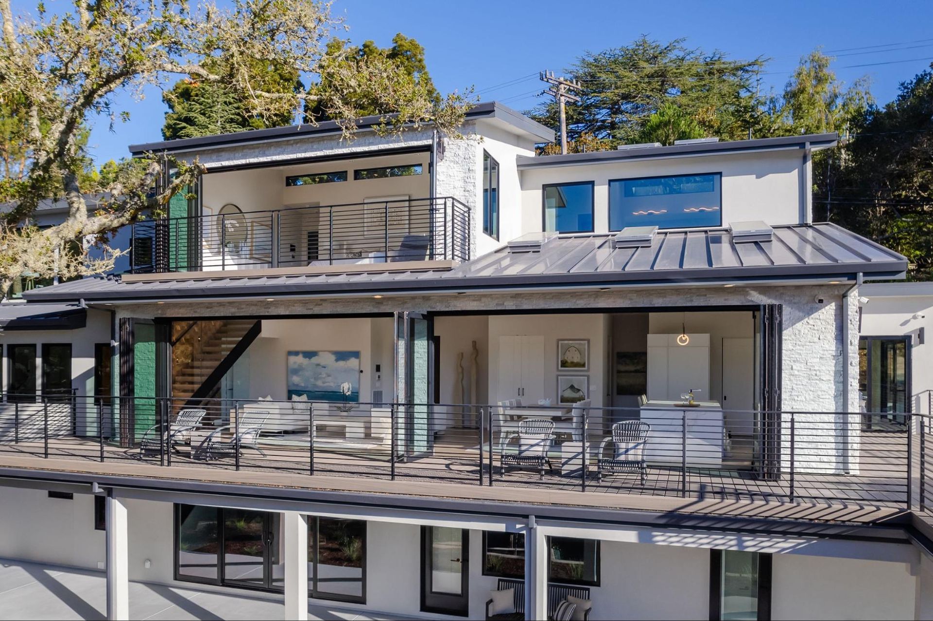 Bifold doors completely open the back of the house on three levels