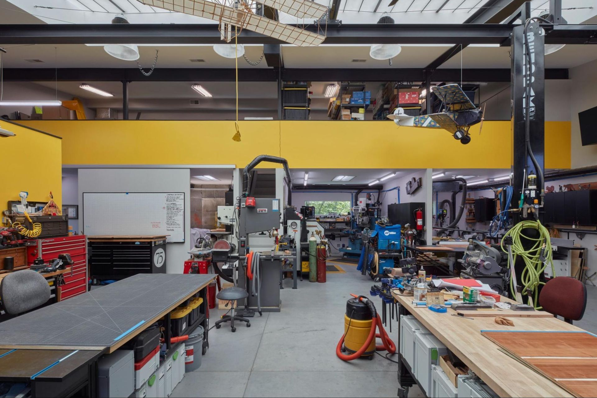 An artist's studio with work tables and machinery