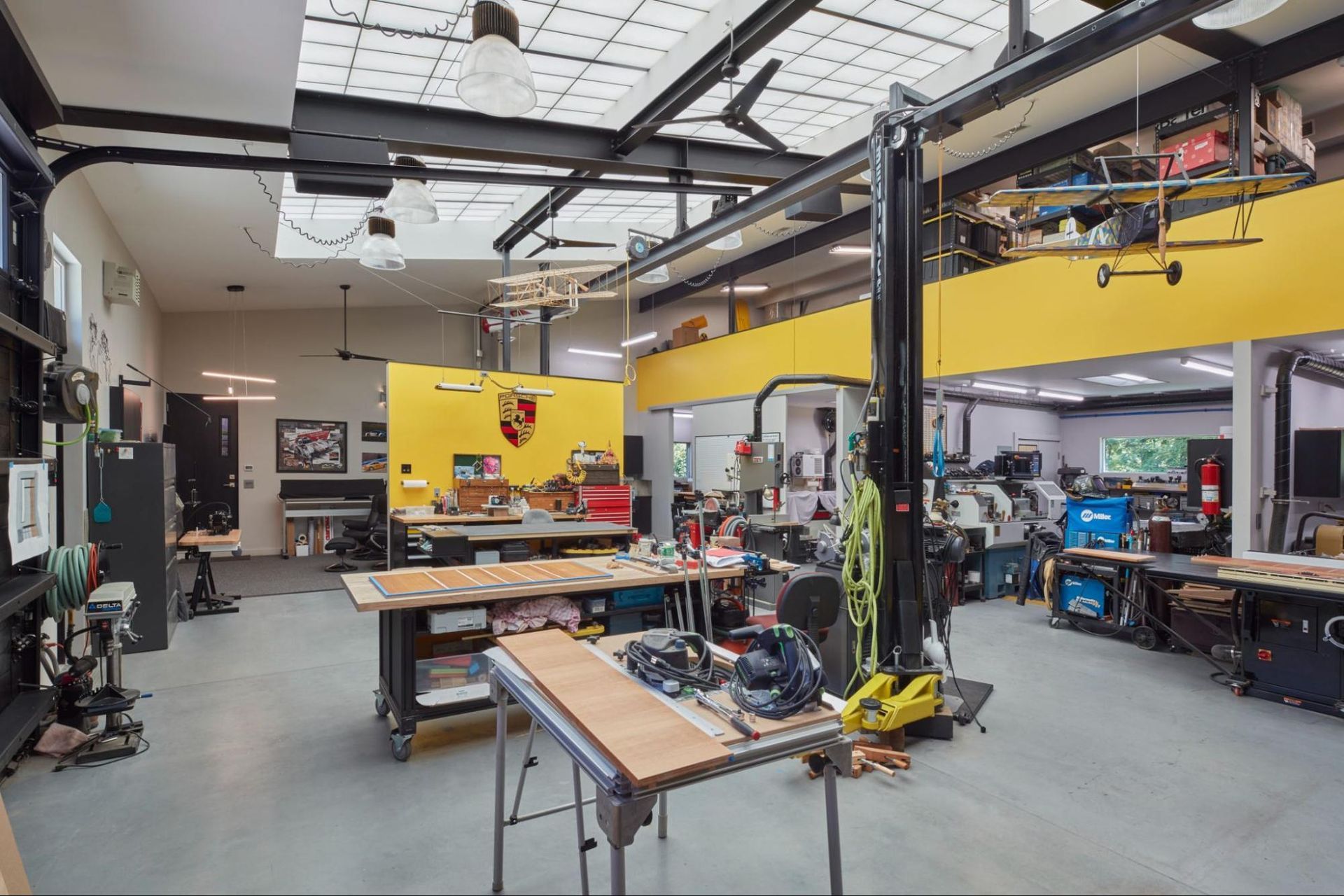 The artist's studio with large skylight, work areas and storage loft