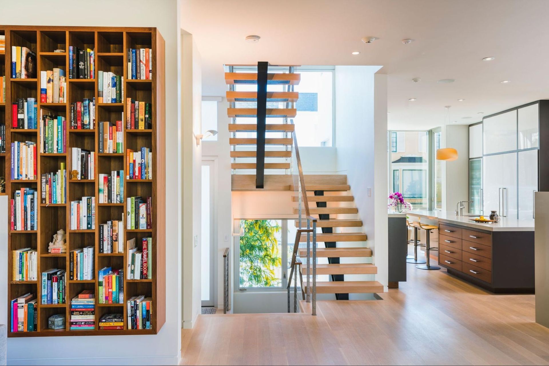 A new floating staircase connects three levels of the house