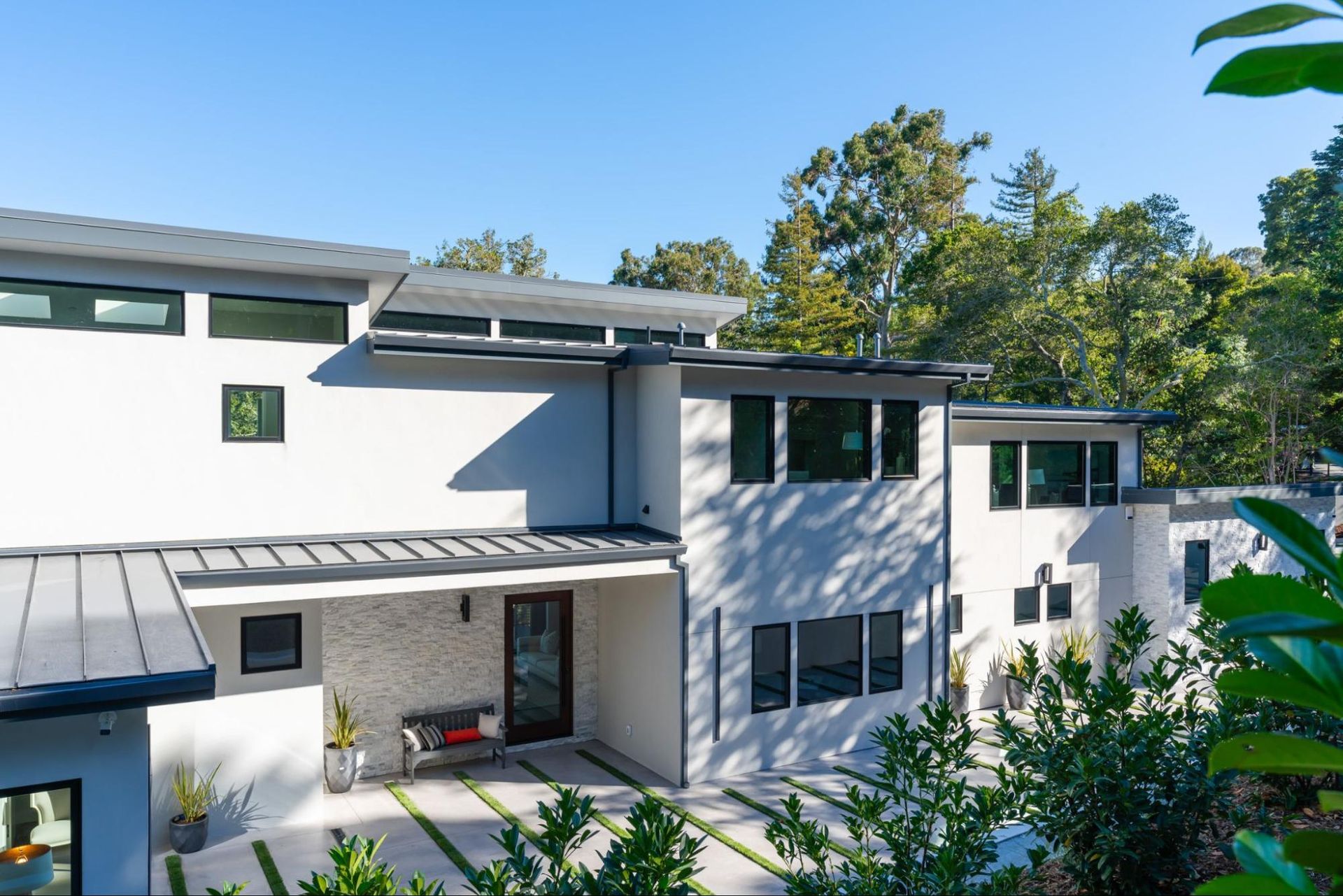 The new second story of the house elevates the house to street level