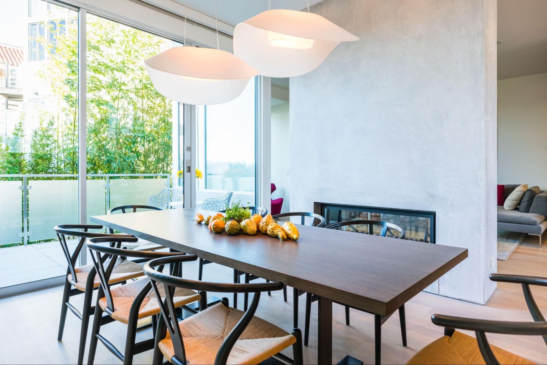 The dining room opens to a rear deck and garden views