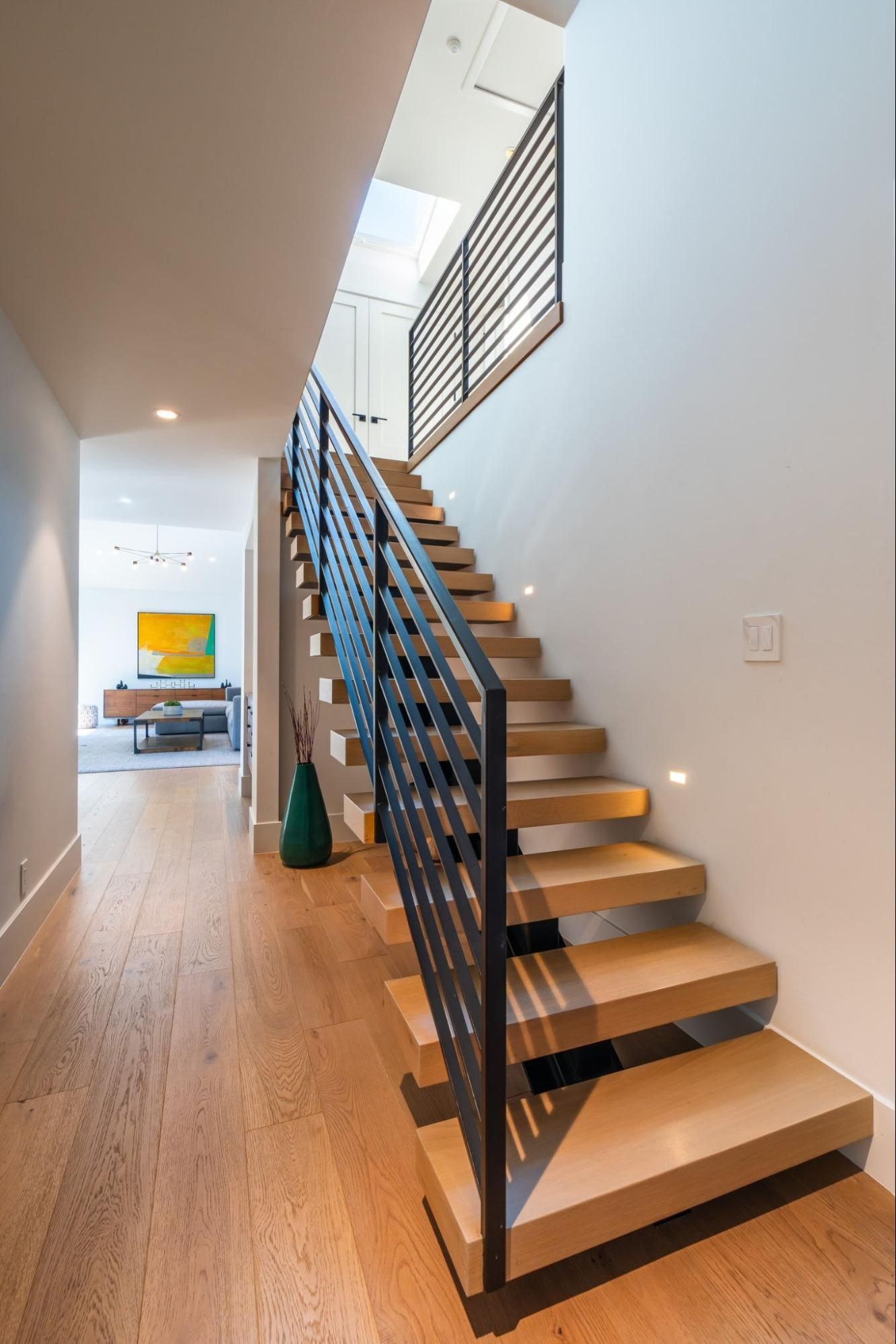 Access to the second floor opened up with a new floating stair