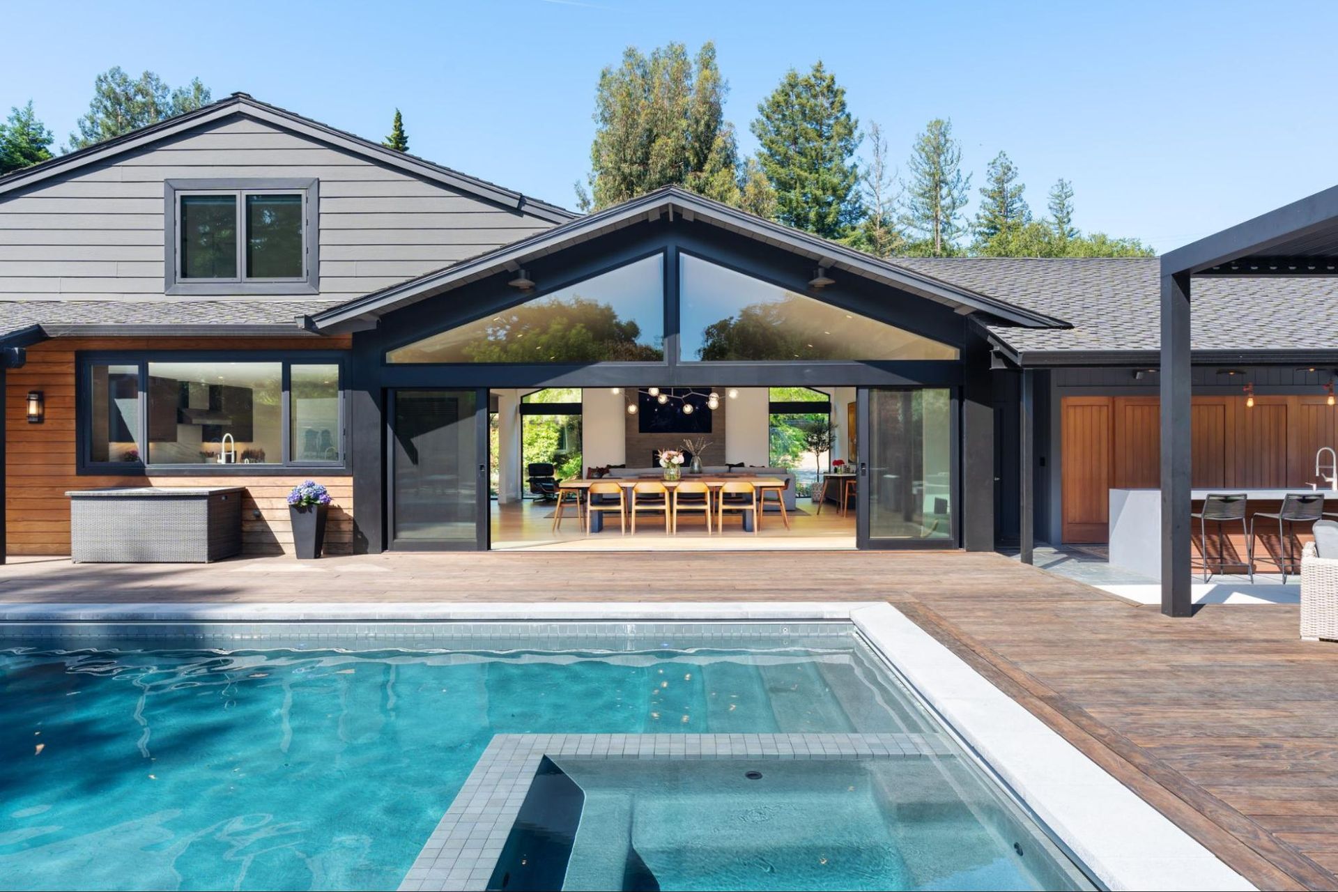 The house extends out to the pool deck 