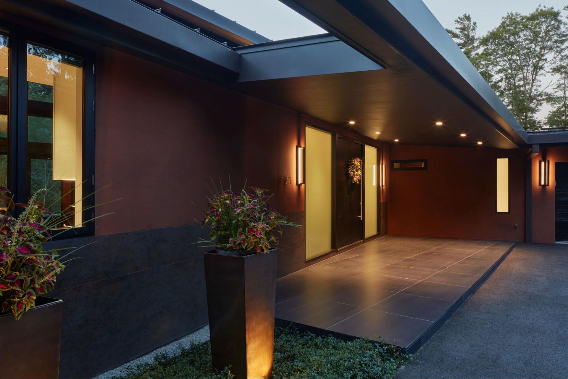 Front entry of the house with a deep roof overhang