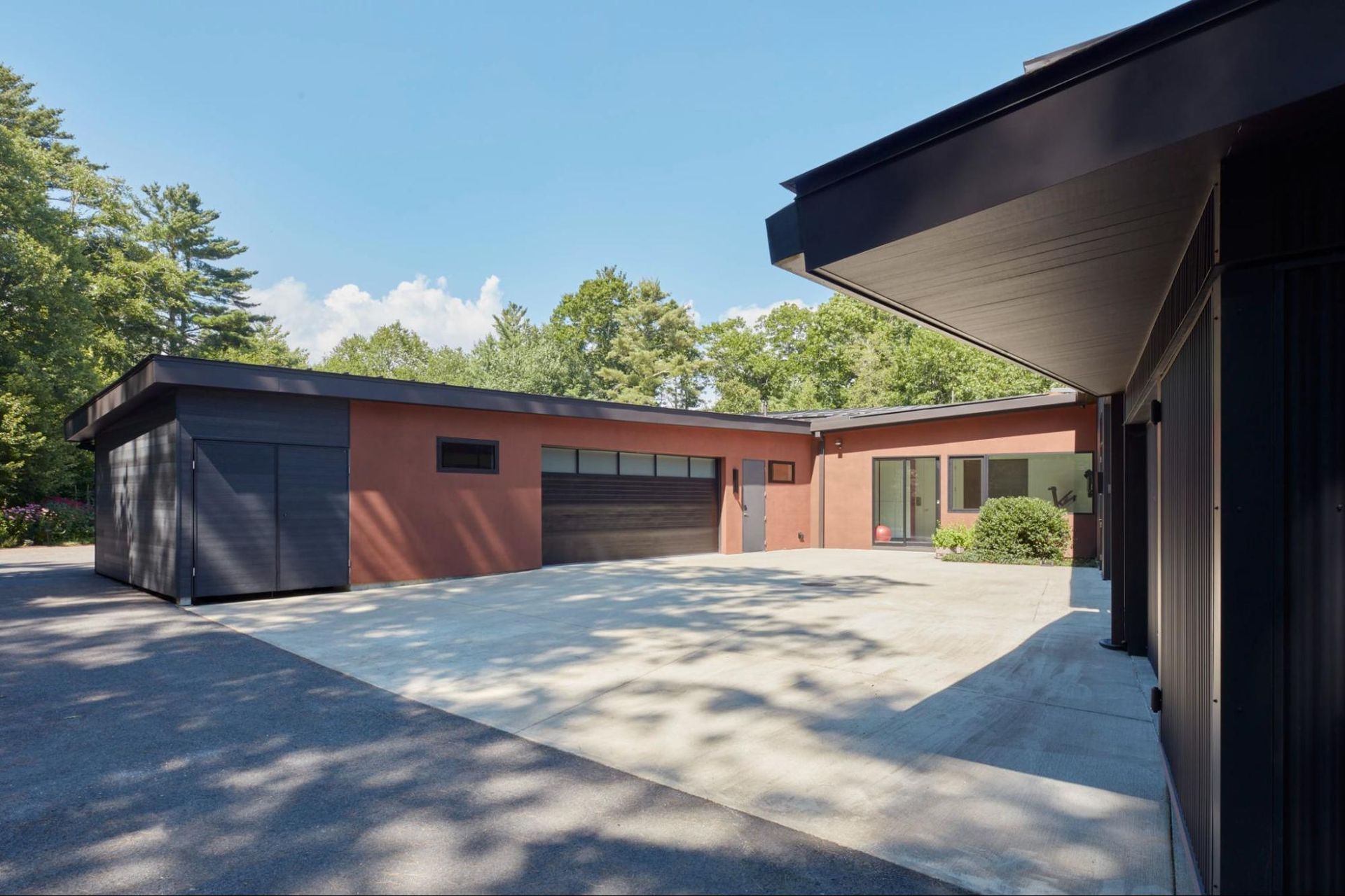 A courtyard connects the garage and artist's studio