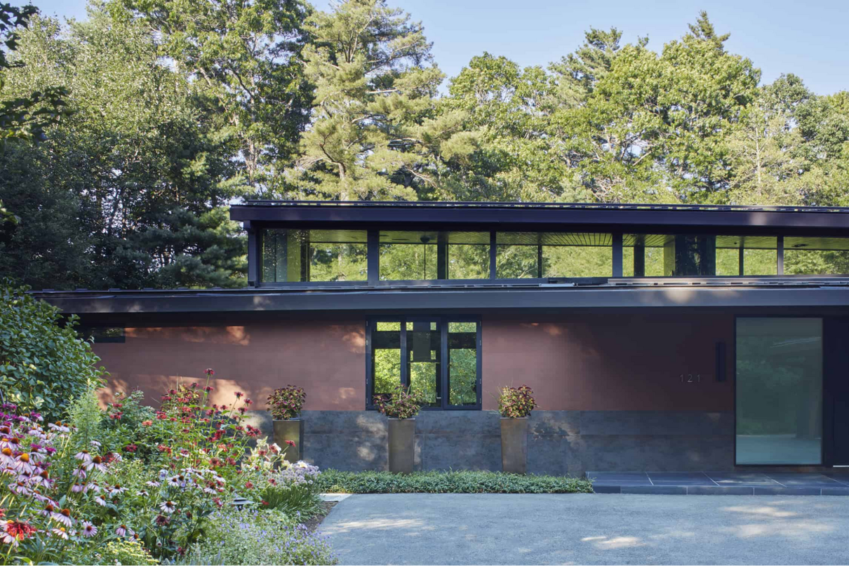 Elegant front facade of a modern house in the woods