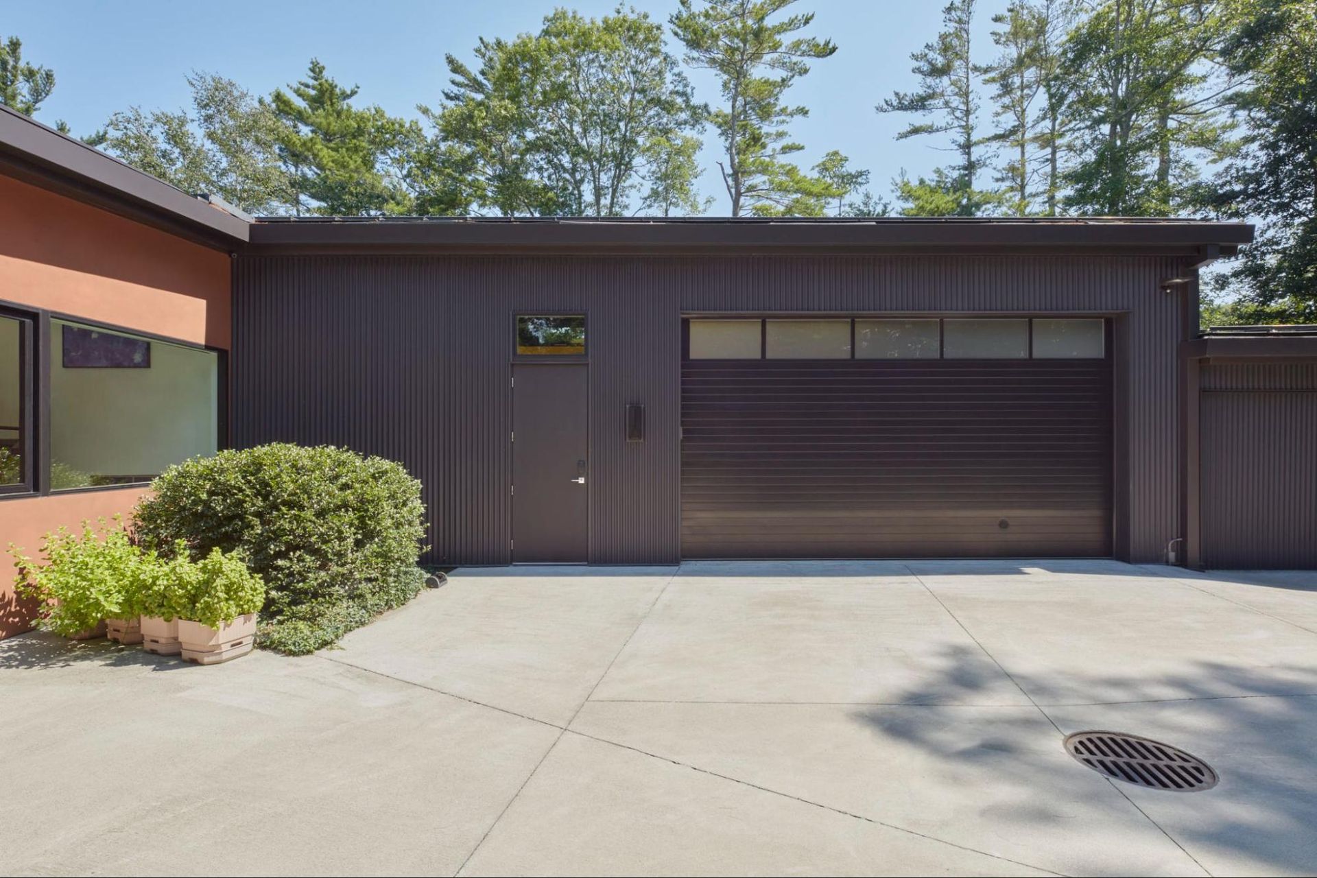 The artist's studio overhead door opens up to a courtyard 