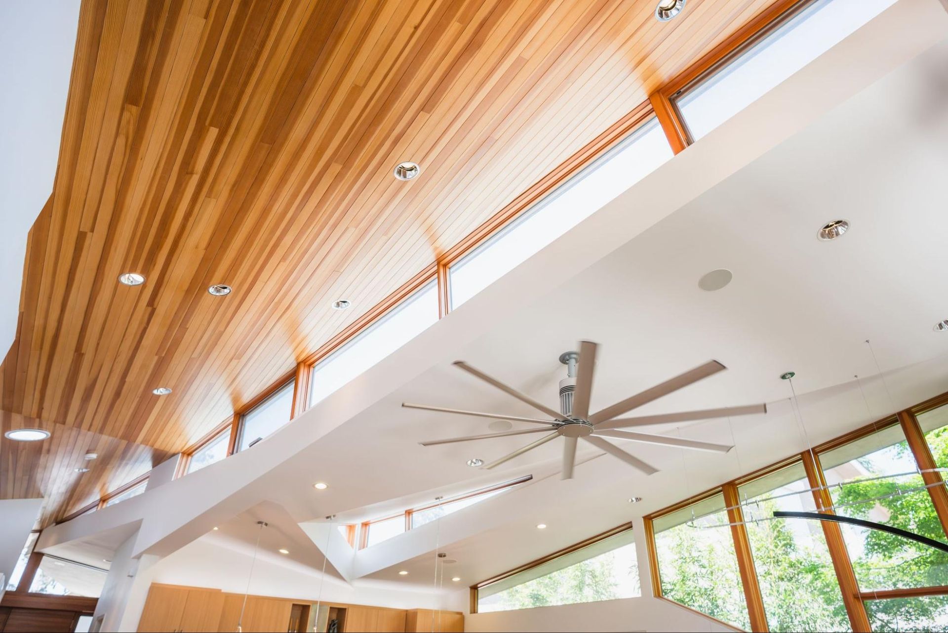 A dramatic sloping ceiling composition with angled windows on 4 sides