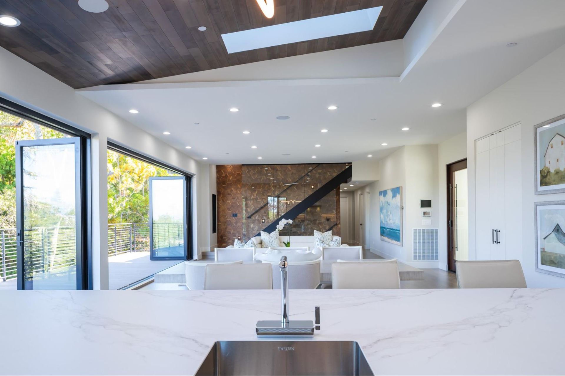 The kitchen has views of the dining and living spaces