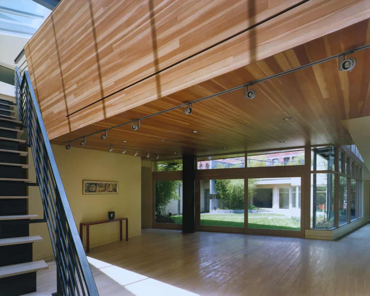 The sloped wood ceiling of the living space looks like the hull of a boat