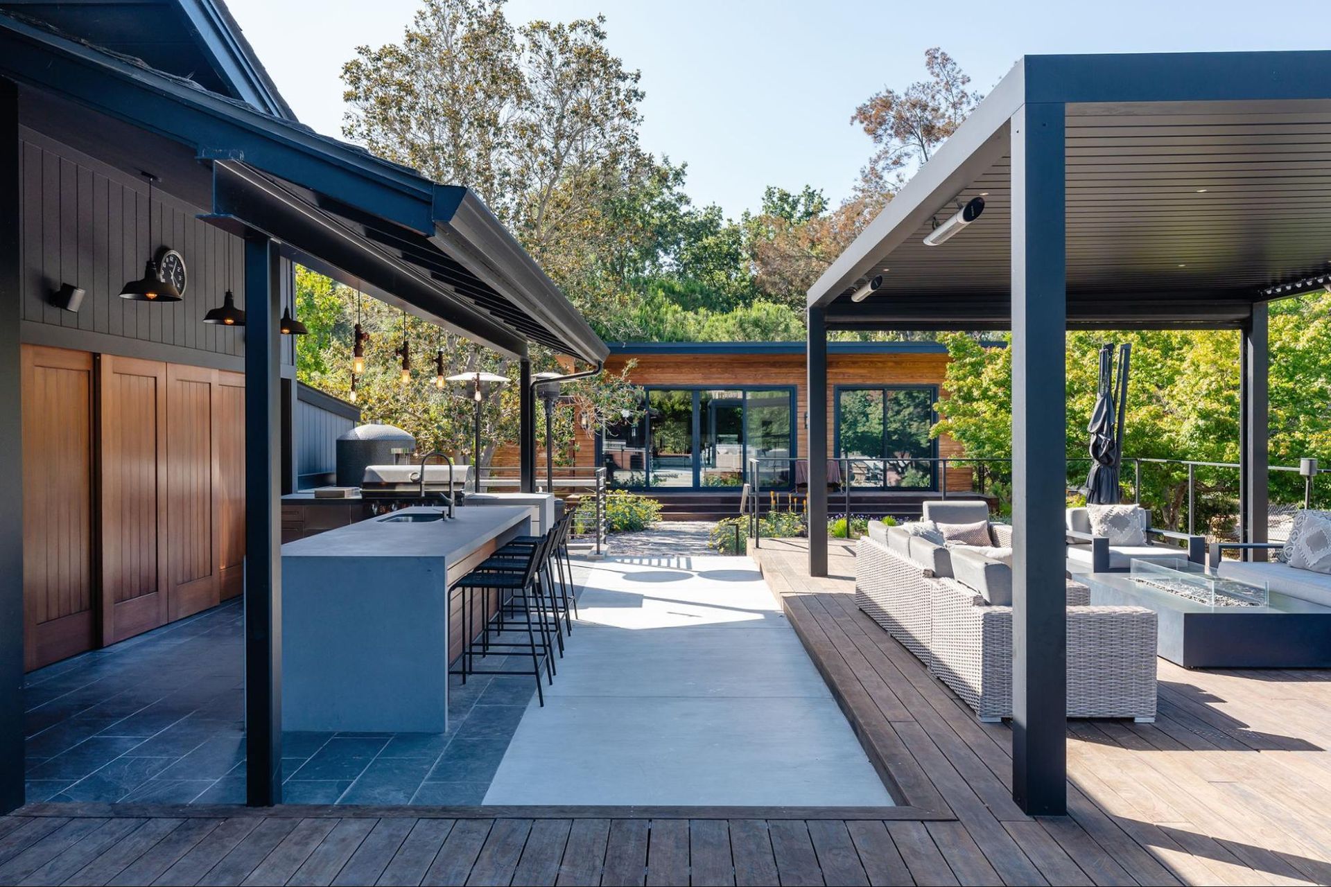 The intersection of an outdoor kitchen, pergola, and accessory dwelling unit 