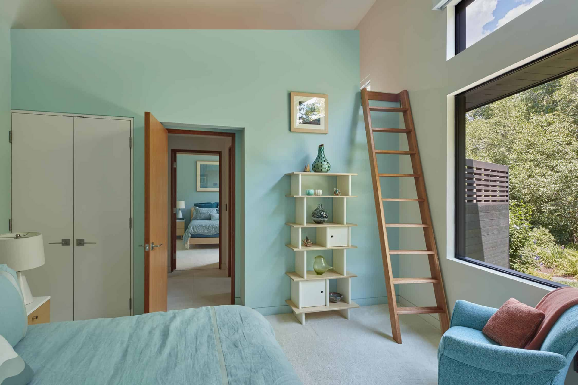 A bedroom with a sleeping loft shares a jack-and-jill bathroom 