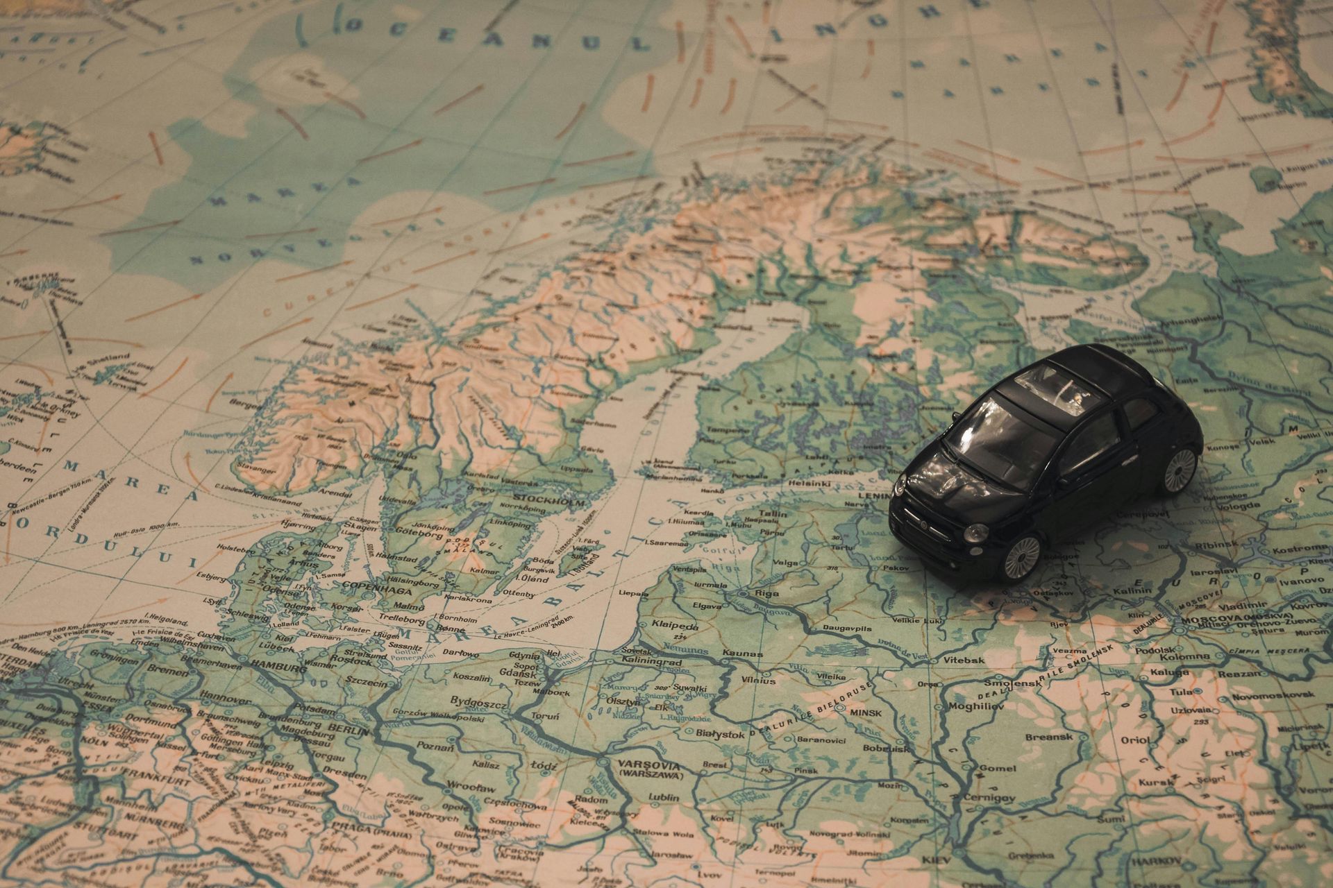 World map with toy car