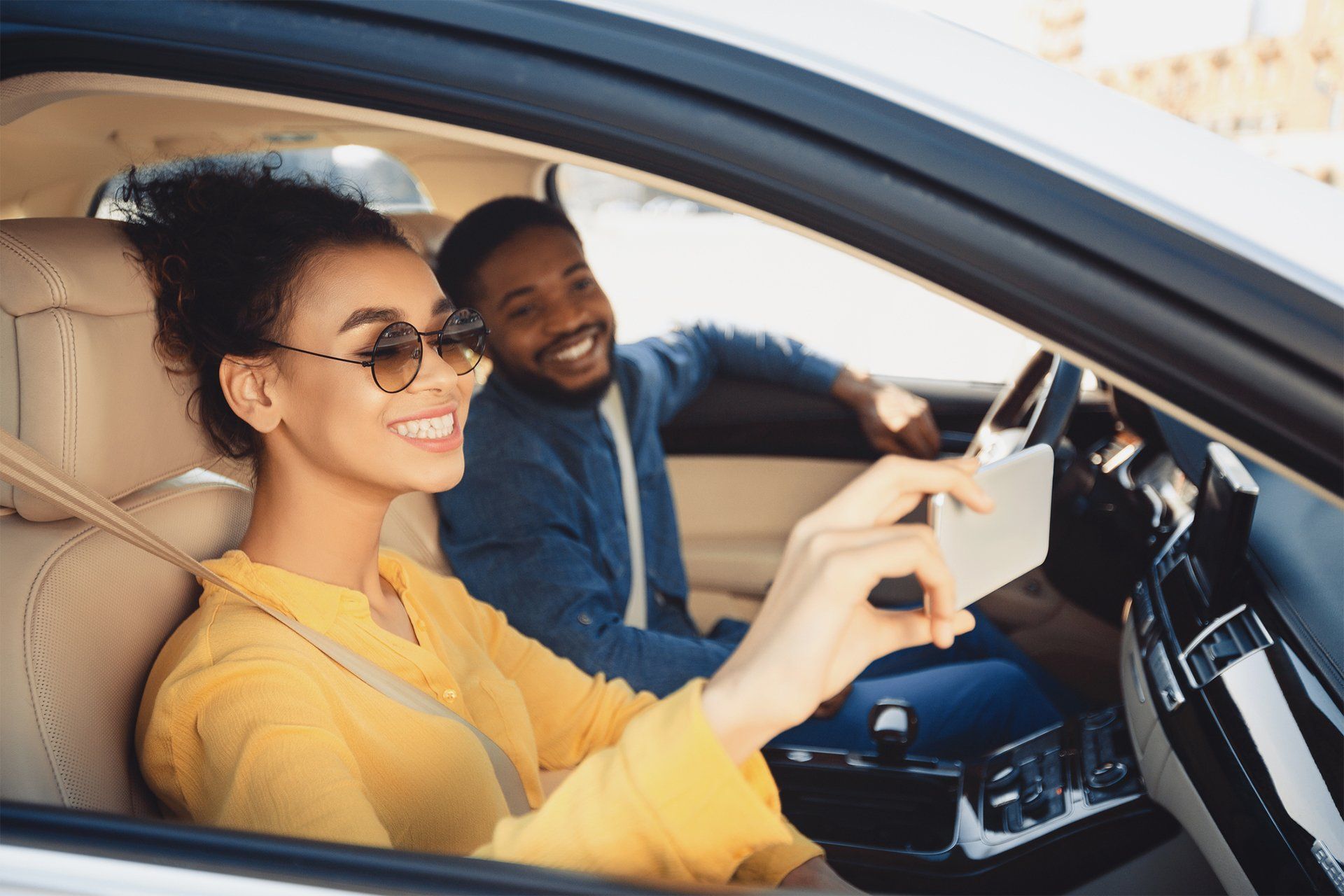 Cheerful Couple In A Car — Broomfield, CO — Kyle Insurance Group LLC