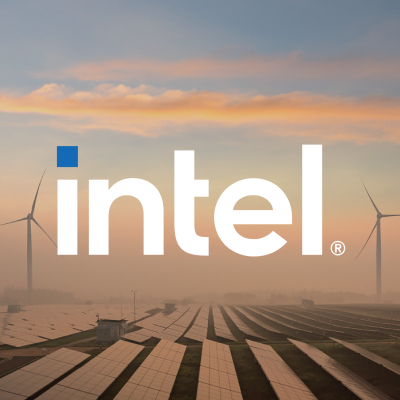 Intel logo over solar panels and wind turbines at sunrise.