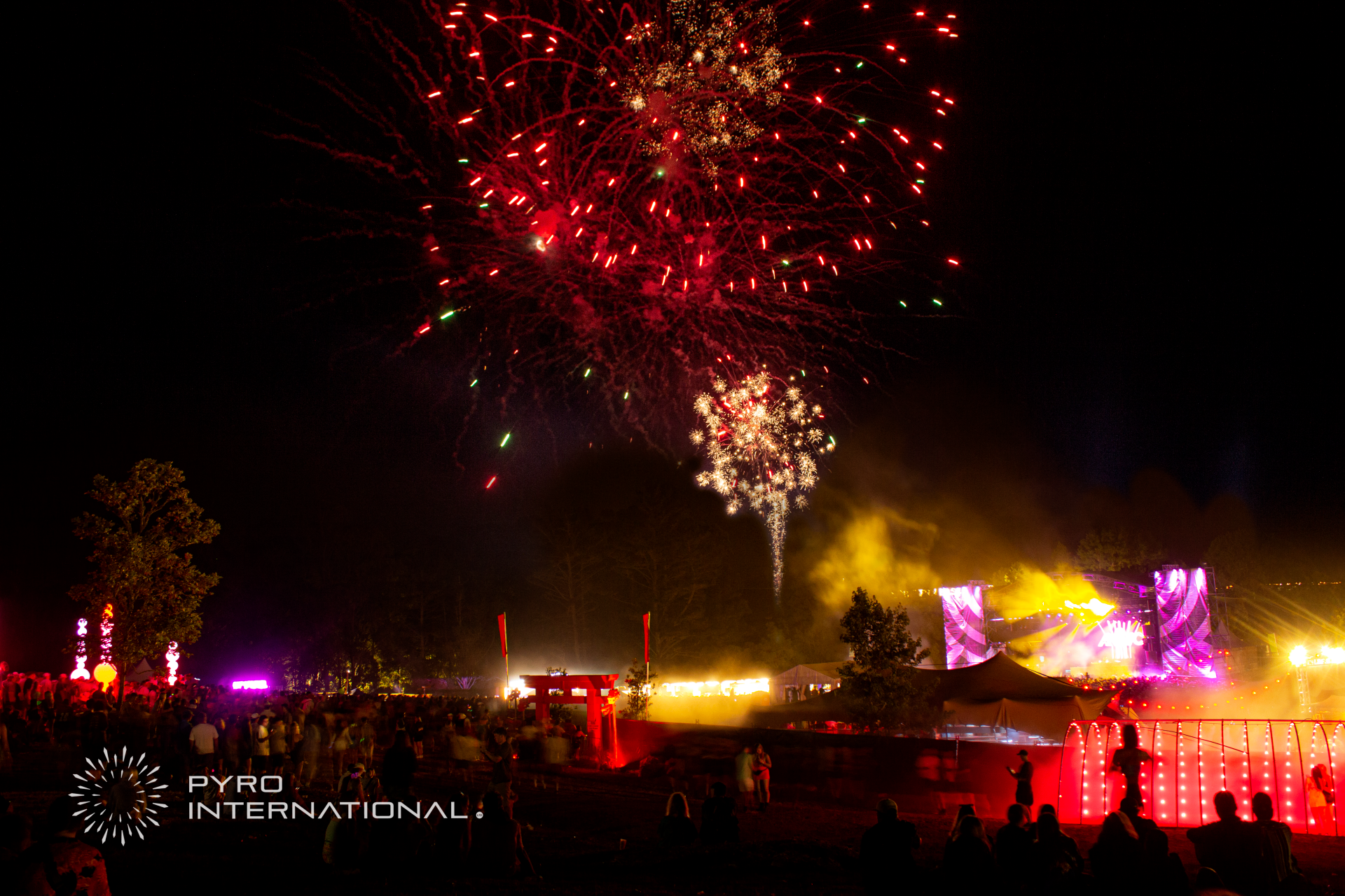 A fireworks display with pyro international written on the bottom