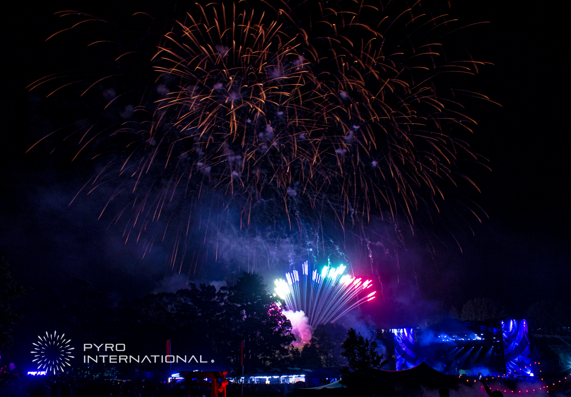 A large fireworks display is taking place in the night sky. at northern Bass