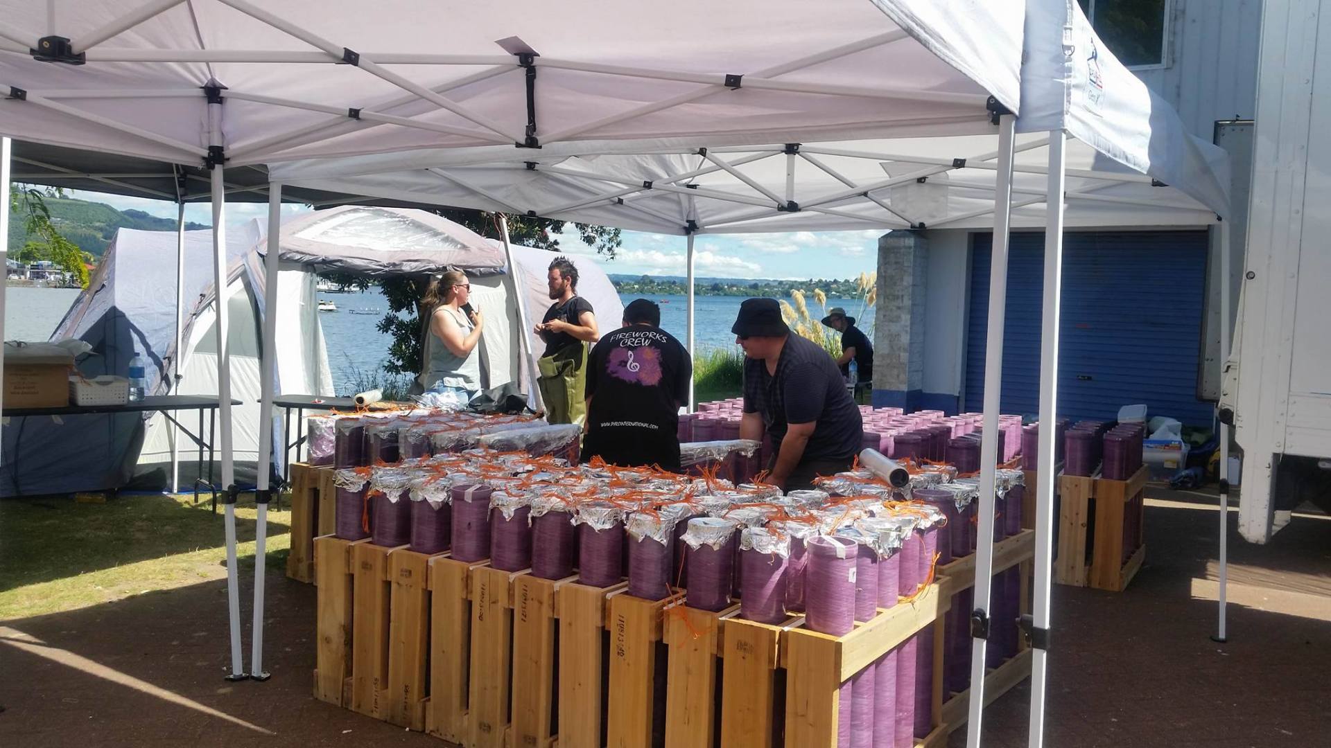 A group of people are working on a fireworks display