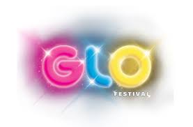 The logo for the glo festival is glowing in the dark.