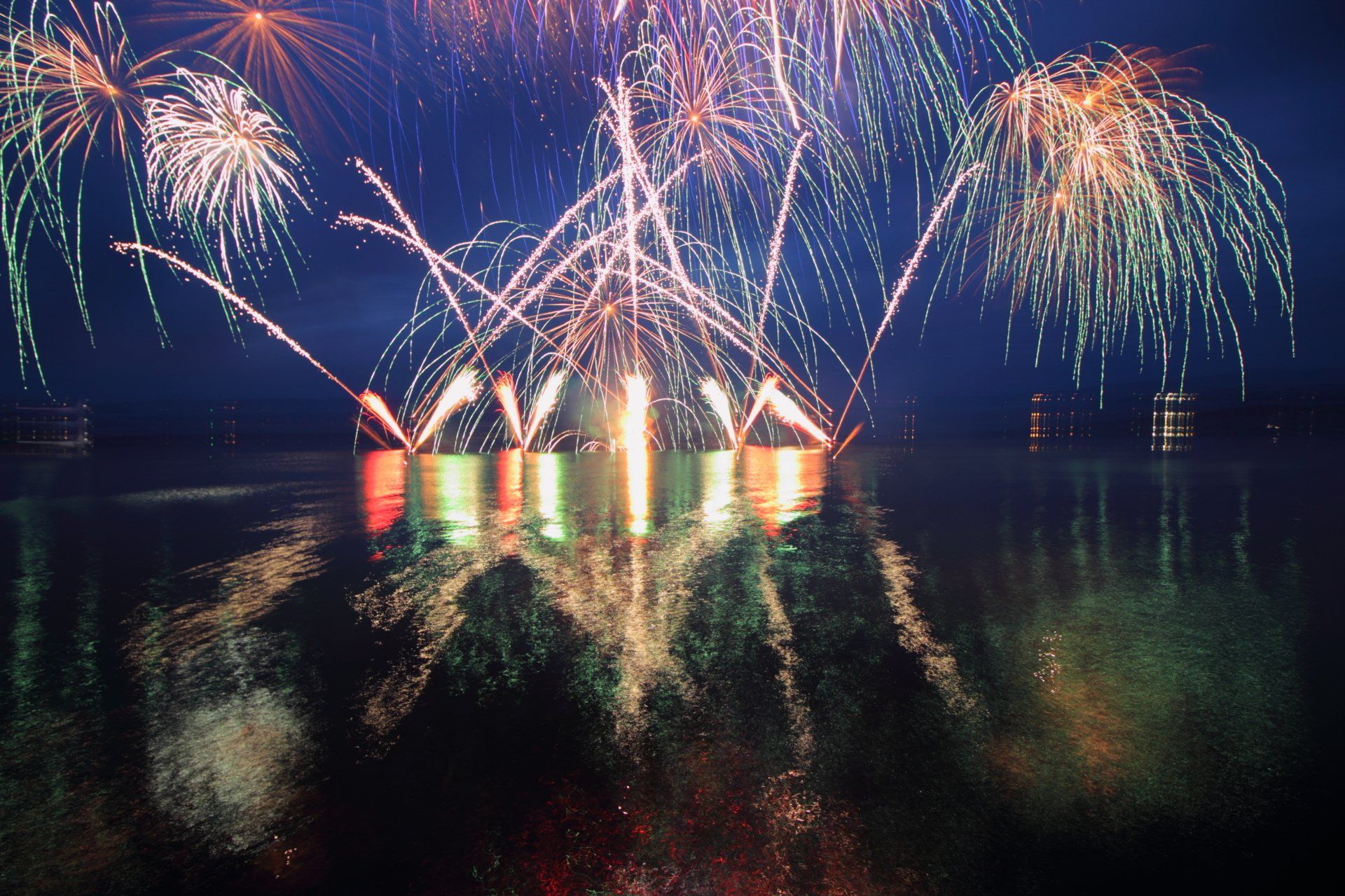 Fireworks are displayed over a body of water in Rotorua 