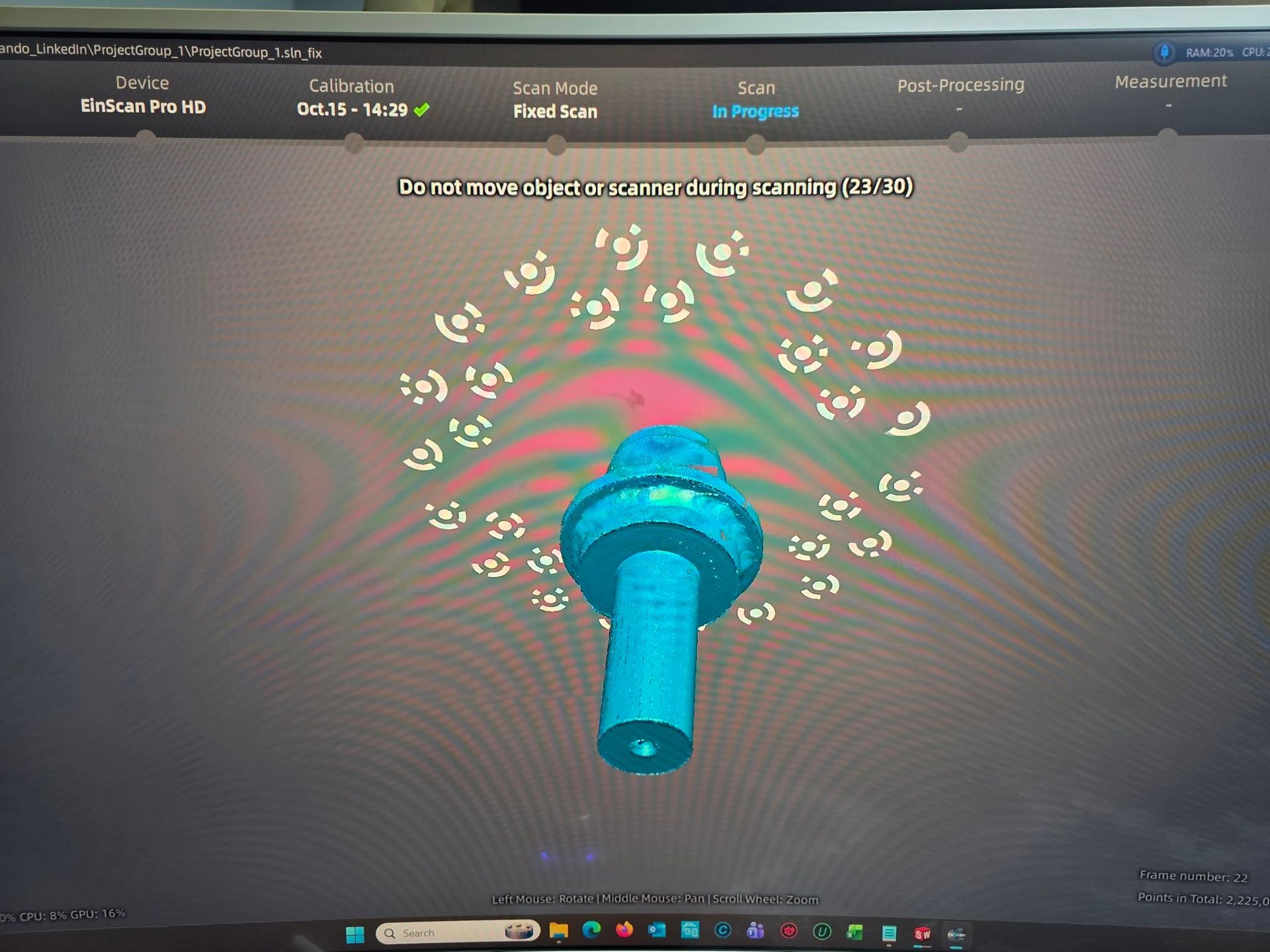 A blue, cylindrical object on a computer screen is surrounded by white circular markers.