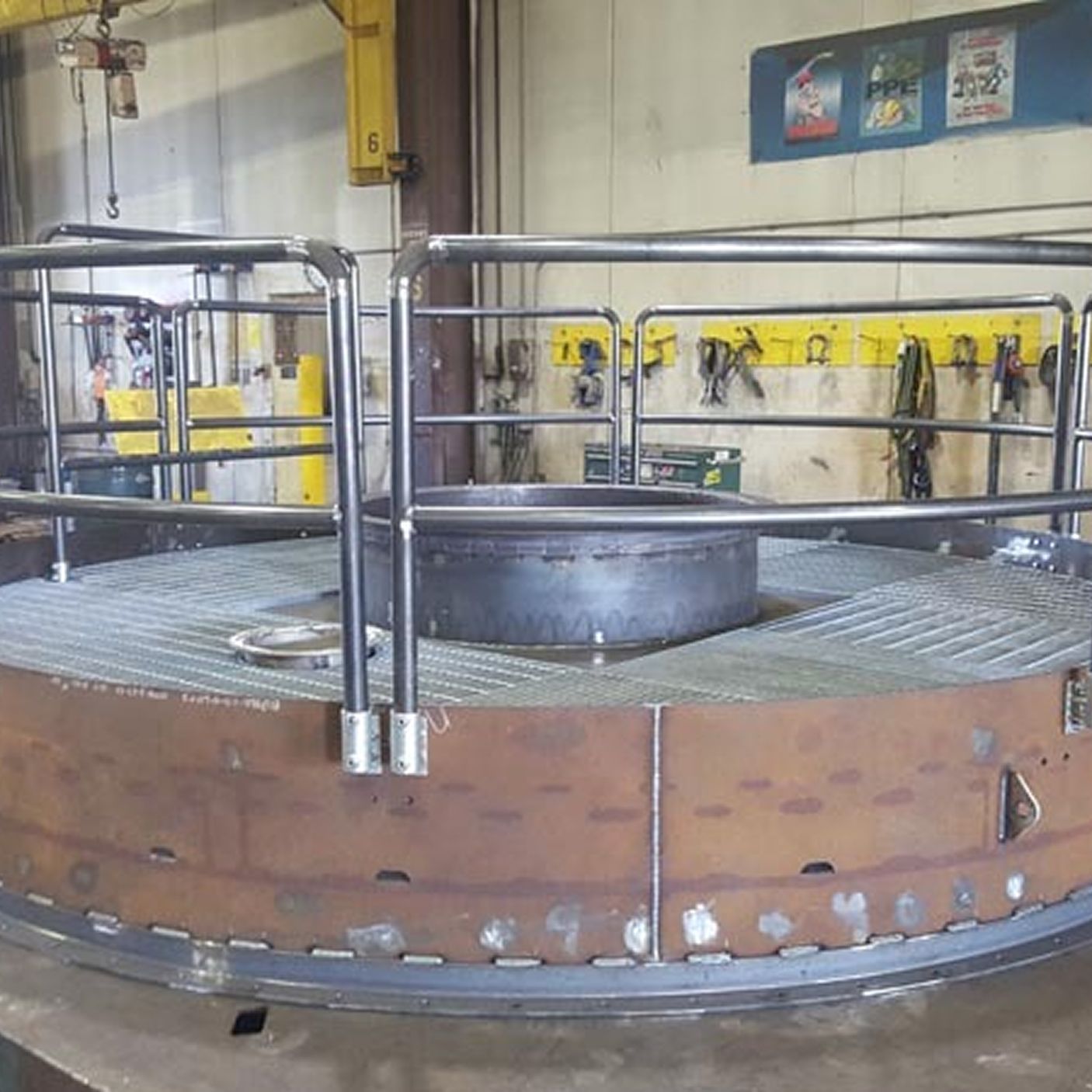 CNC machine milling a metal gear. Close-up with coolant hoses visible.