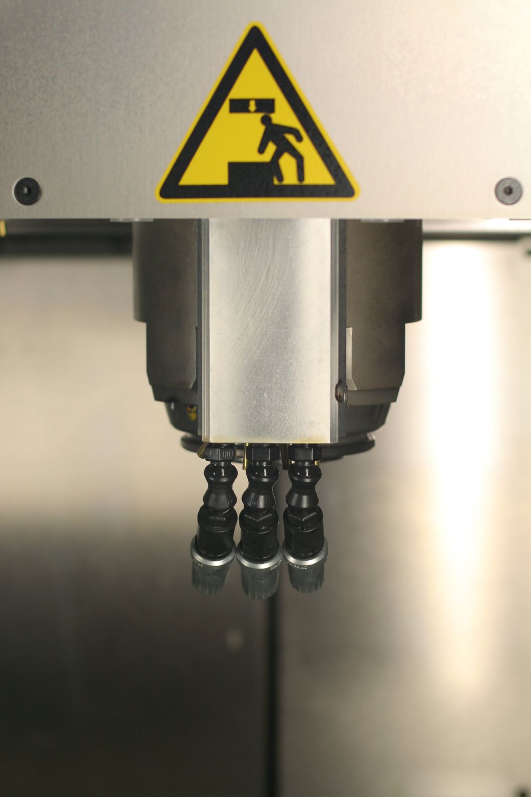 CNC machine milling a metal gear.