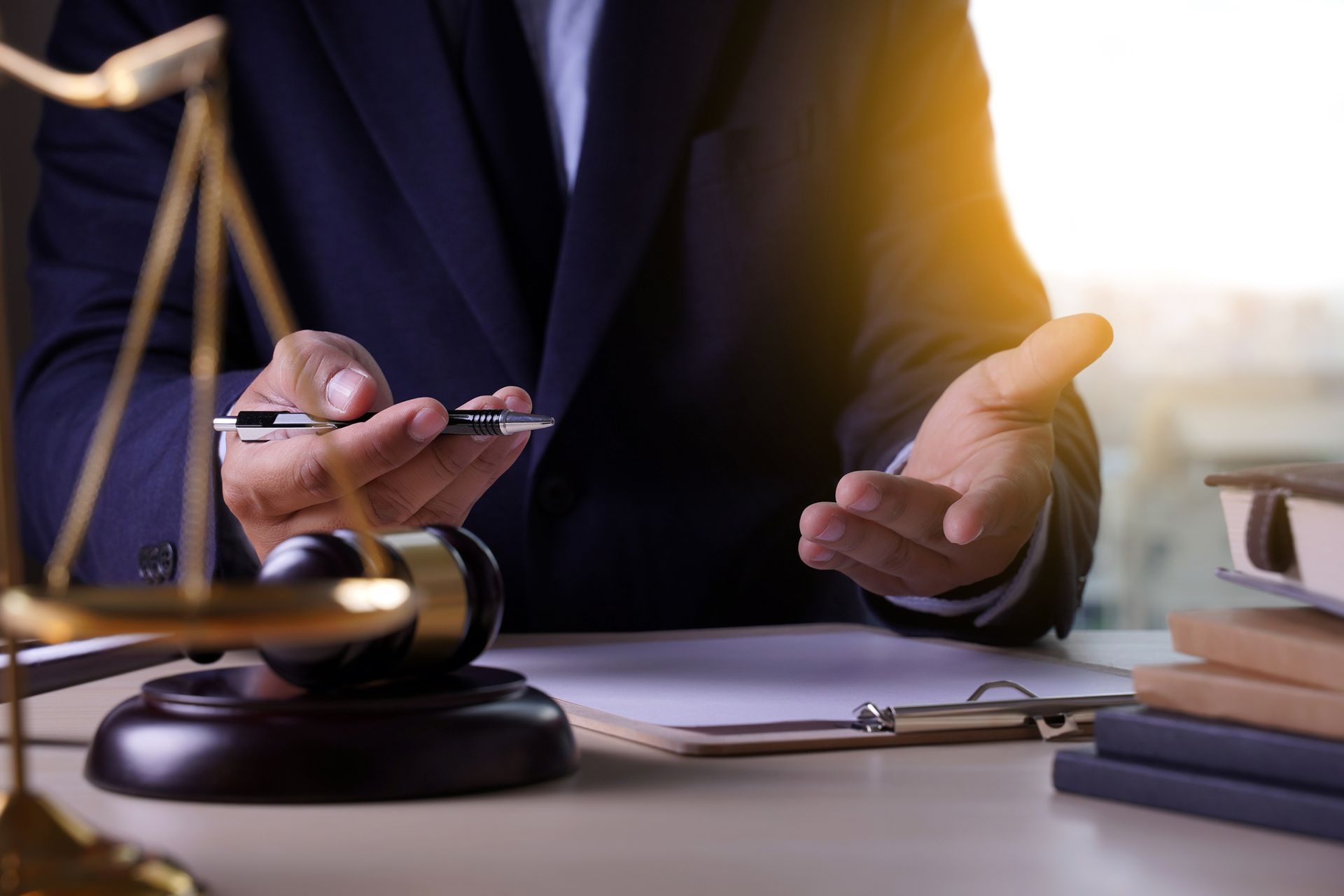 A judge holding a pen and pointing at a document | Auto Accident Lawyer in Corvallis, OR | Walsh And