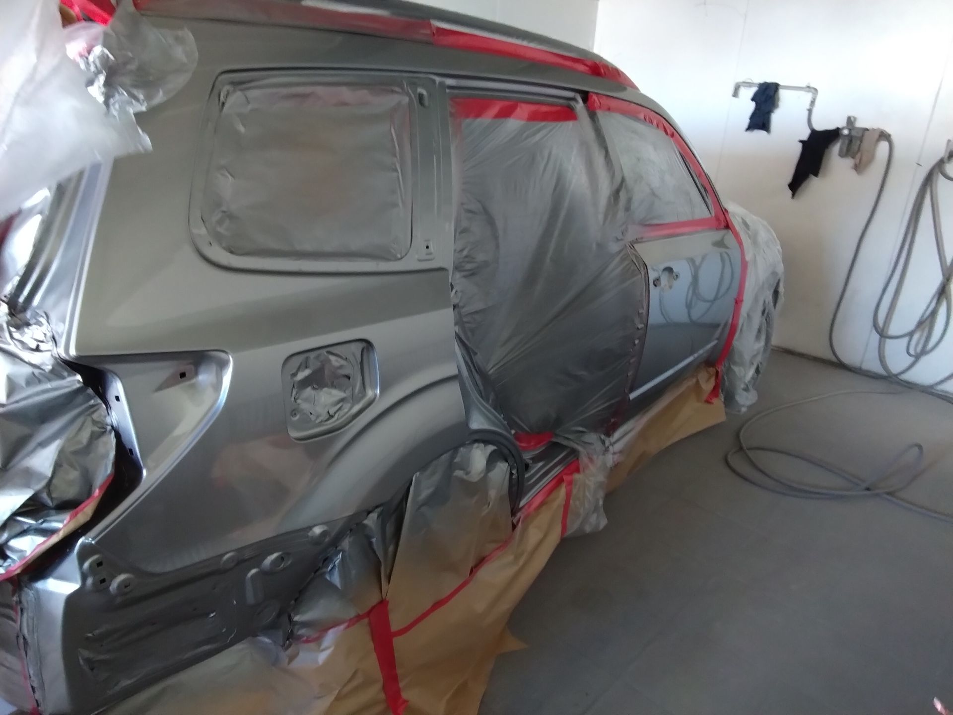 A white dodge charger is parked in a parking lot — Proserpine Smash Repairs & Restorations In Proserpine, QLD