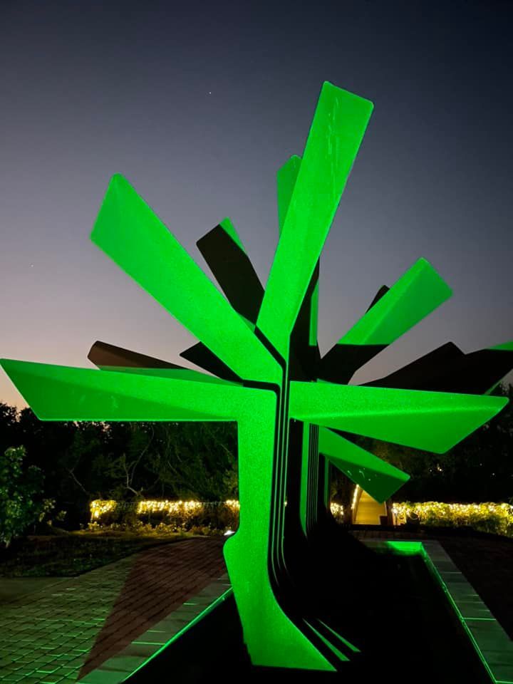 gardens aglow steel palm green lights