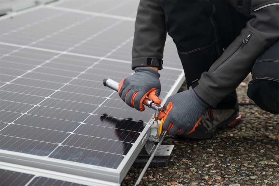 A large brick house is lit up at night.