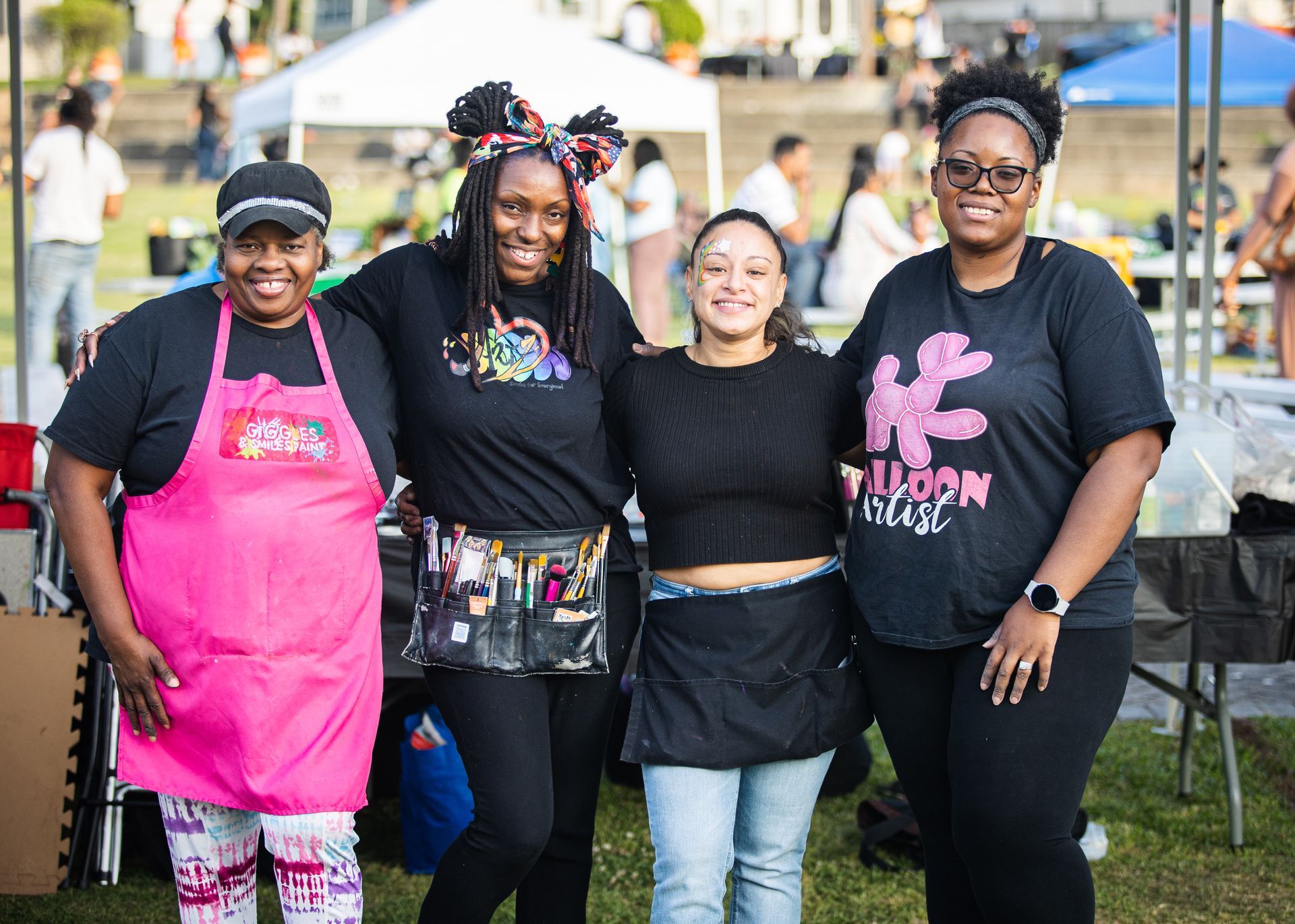 A group of women are posing for a picture together.