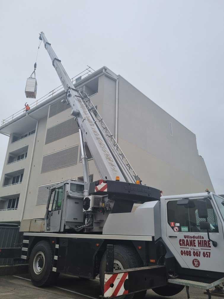 Crane Lifting Metal Box — Ulladulla Crane Hire in Milton, NSW